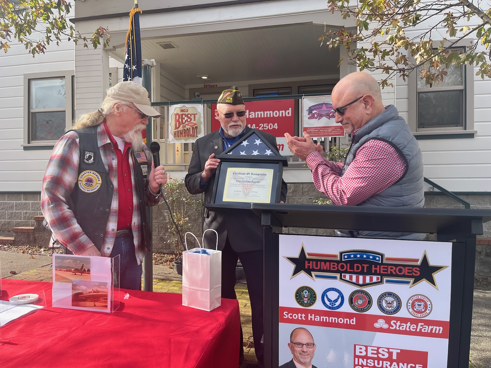 A Humboldt Heroes veteran receiving a folded flag and Certificate of Recognition