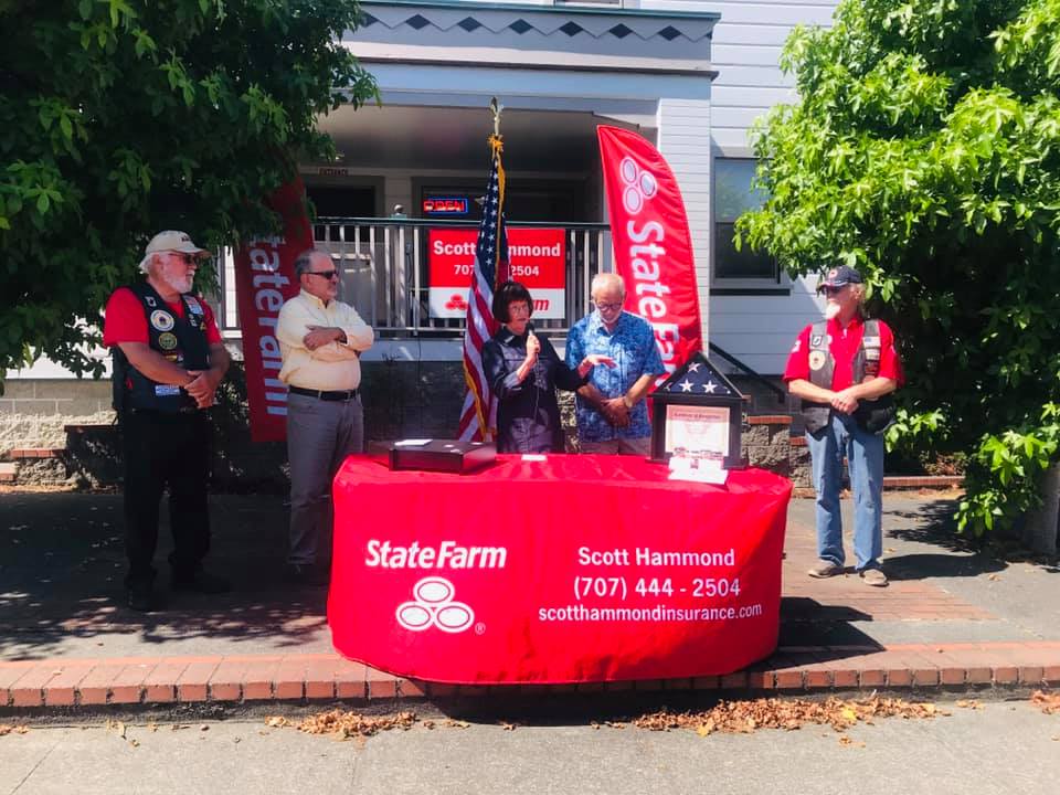 The Humboldt Heroes ceremony table outside the Scott Hammond State Farm office in Eureka