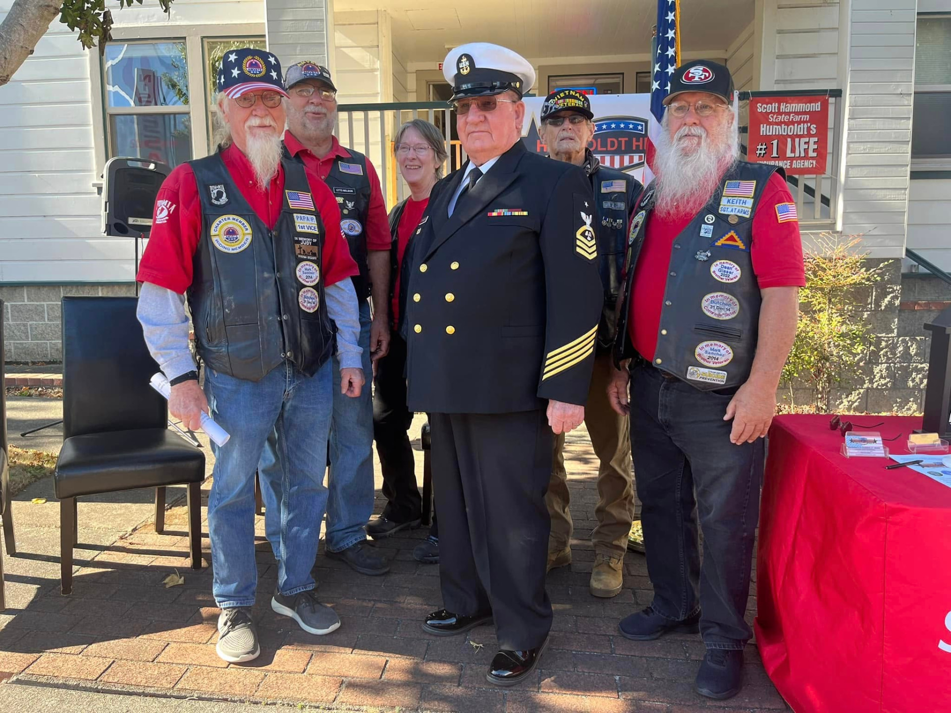 A U.S. Navy veteran standing with Humboldt Heroes volunteers at a recognition ceremony